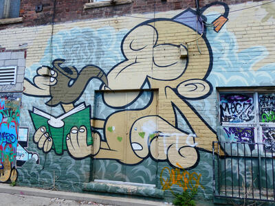 monkey in fez smoking pipe and reading