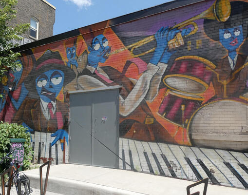 wall painting of musicians with blue faces