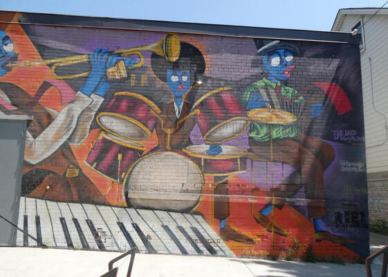 wall painting of musicians with blue faces