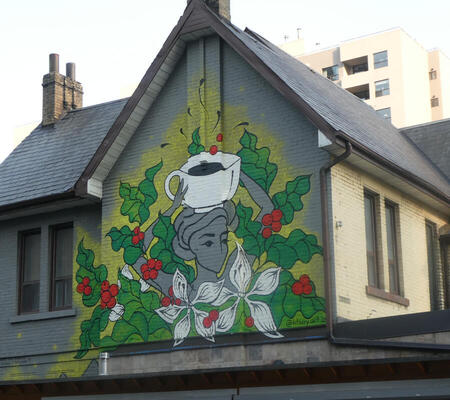 wall painting woman with coffee cup on head