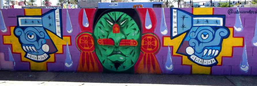 Fence with aztec faces on it