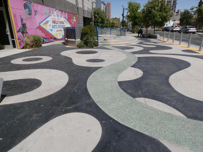 winding green stripe on sidewalk