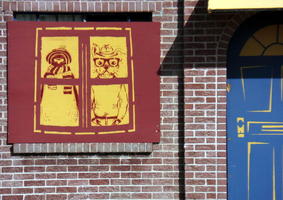 Painted “windows” and “doors” on boarded-up hotel