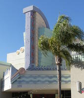 Art Deco style signage in pastel blue and green for a movie theater