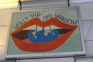 Painting of mouth “eating” the earth and text: “Do you really want that?”