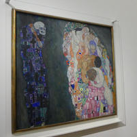 Painting with death on left, group of people on right