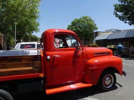 Reddish-orange old pickup truck