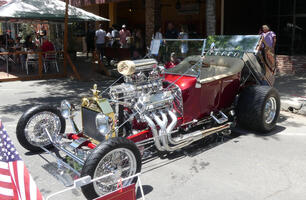 Red race car with large external engine