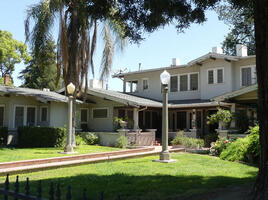 Old house with two old-style lamp posts in front